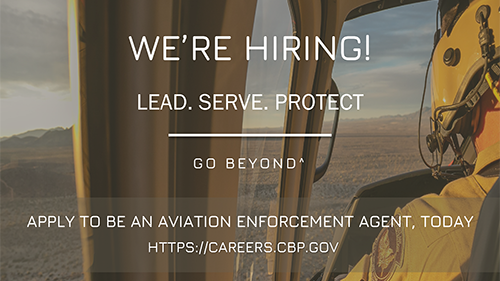 AMO pilot in air with mountain landscape. Text reads We're hiring! Lead. Serve. Protect. Go Beyond. Apply to be an aviation enforcement Agent today