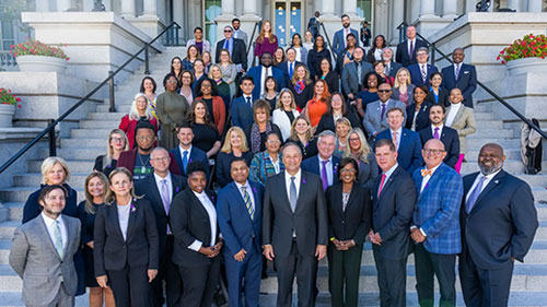 Second Gentleman Doug Emhoff and ONDCP Director Dr. Rahul Gupta pose for a photo with attendees of the Office of National Drug Control Policy Recovery Summit, Friday, September 23, 2022.