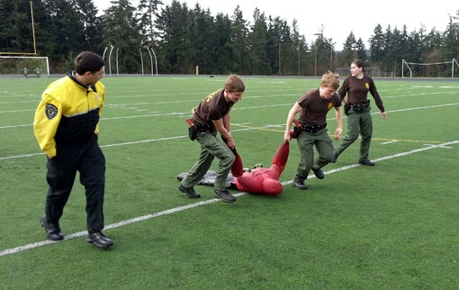 Two Explorers drag a 170-pound dummy during the Physical Agility event.  