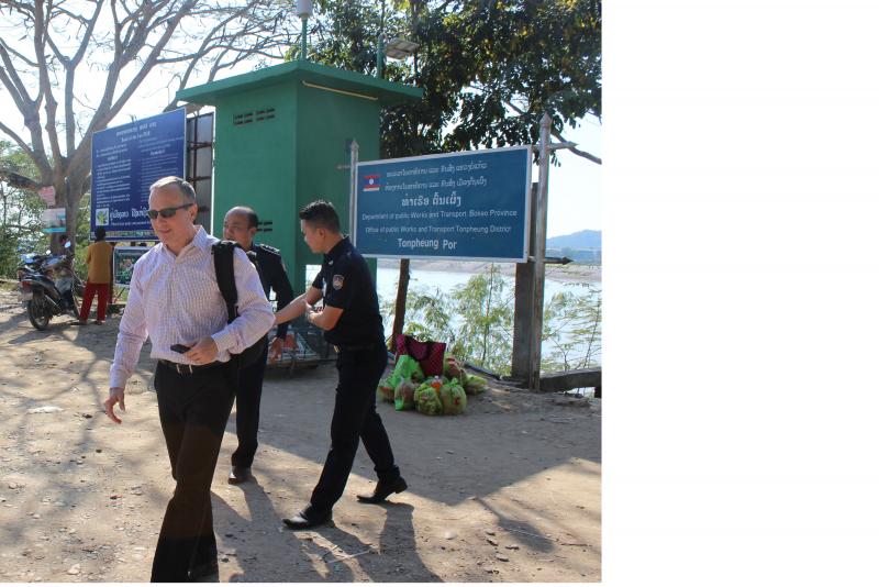 Attaché Robert Thommen evaluates interdiction training for two Laos customs officials at Tonphueng Port, a remote Mekong River border crossing opposite Burma. Photo courtesy of Robert Thommen