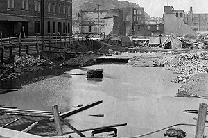 Excavated construction site for the San Francisco Customhouse collected water which was used to fight the fire that followed the earthquake.