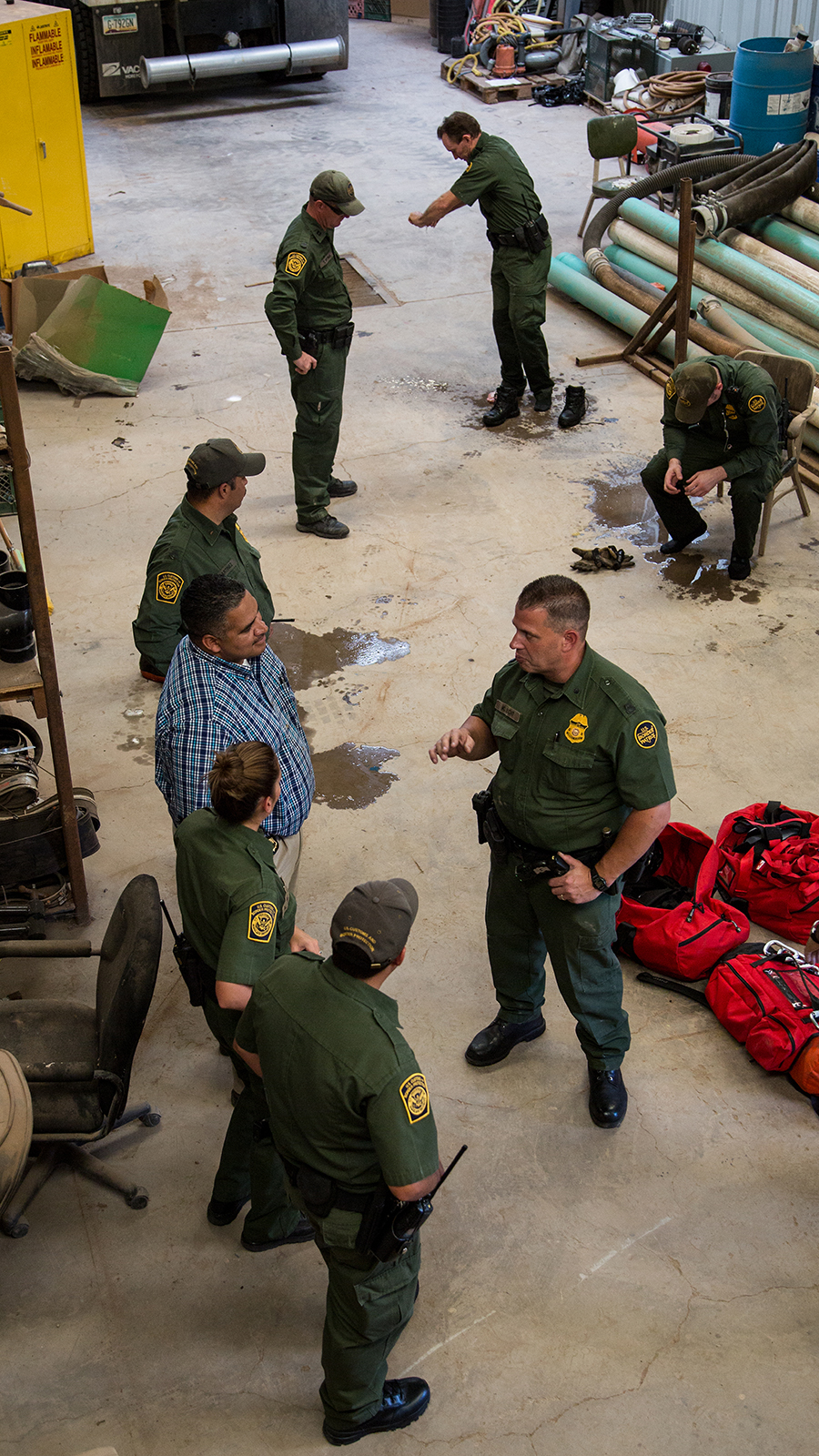 A photo showing Border Patrol agents gathering after exploring. the tunnel