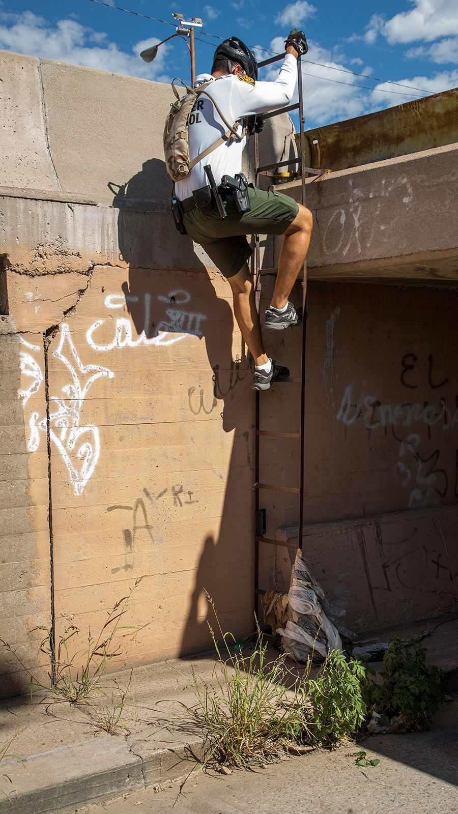 Photo of a Border Patrol agent entering the main drainage tunnel in Nogales, Arizona