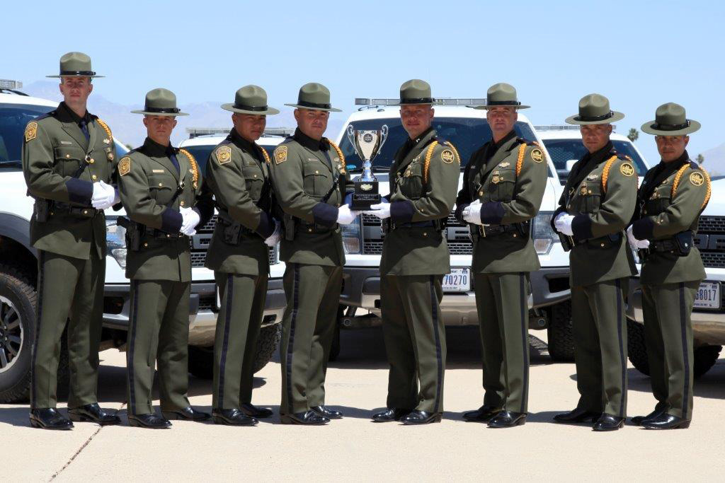 Tucson Sector Border Patrol Honor Guard members holding championship Trophy
