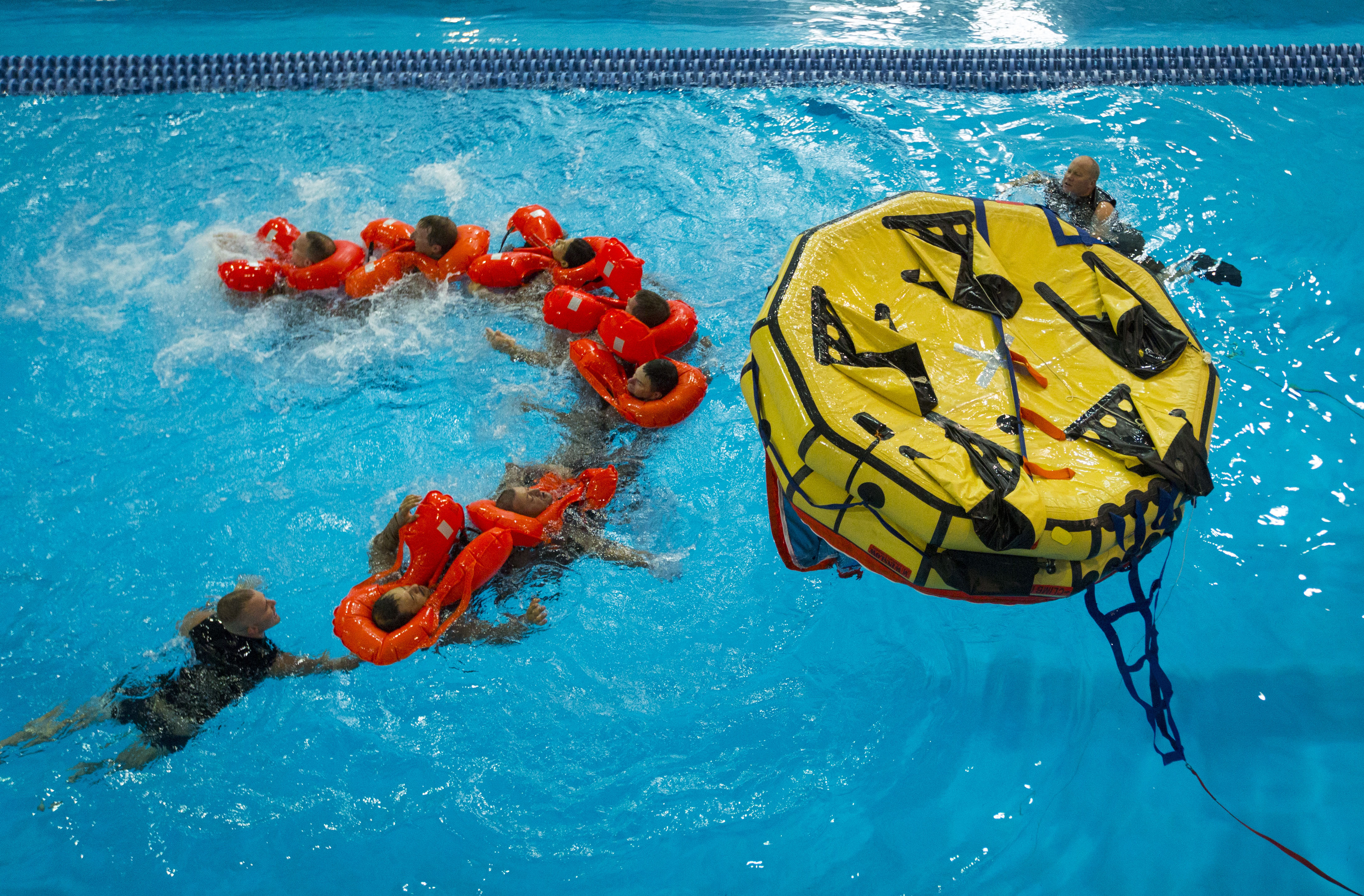 A human chain keeps survivors together, provides mobility and even warmth while moving through the water.
