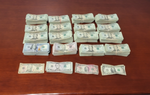 Stacks containing $124,052 in unreported currency seized by CBP officers at Eagle Pass Port of Entry.