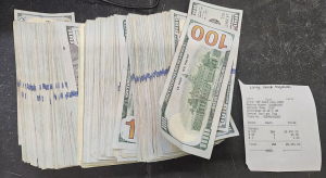 Stack containing $71,461 in unreported U.S. currency seized by CBP officers at Eagle Pass Port of Entry.