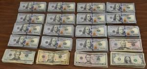 Stacks containing $76,185 in unreported U.S. currency seized by CBP officers at Laredo Port of Entry.