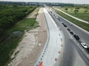 An aerial view of a new two-lane roadway at Del Rio Port of Entry, a small-scale infrastructure project under the Donations Acceptance Program in partnership with the City of Del Rio, GSA.