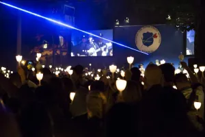 Thousands hold candles aloft to remember fallen officers at the National Law Enforcement Officers Memorial candlelight vigil May 13 in Washington, D.C. Photo Credit: James Tourtellotte