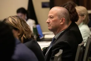 Photo of SOPDOC Miller listening to a presentation