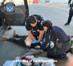 CBP Officers providing medical care.