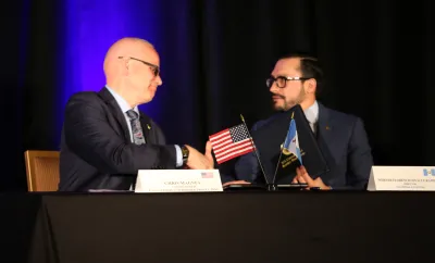 Photo of CBP Commissioner Chris Magnus shaking hands with Werner Ovalle Ramirez, Customs Director of Guatemala.