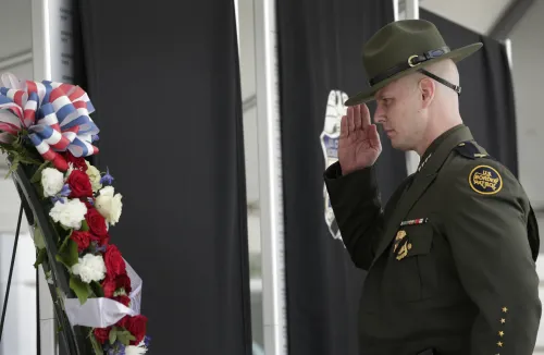 Border Patrol Chief Jason Owens salutes the fallen during CBP's 2024 Valor Memorial and Wreath Laying Ceremony. 