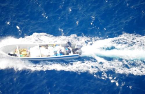 A "go-fast" vessel loaded with drugs moving at high speed in the Pacific Ocean.