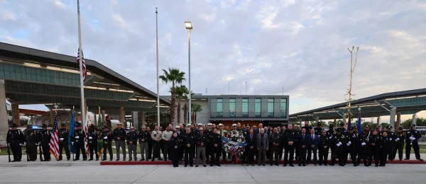 Uniformed officers and agents from U.S. Customs and Border Protection's Office of Field Operations, Laredo Port of Entry, Laredo Field Office, Laredo Sector Border Patrol, Homeland Security Investigations, Laredo Police Department, Laredo Fire Department, Webb County Sheriff's Department and U.S. Consulate General, Nuevo Laredo gather for a group photo to pay tribute to the victims and survivors of the 9/11 attacks in the 23rd annual remembrance ceremony held at Juarez-Lincoln Bridge. 