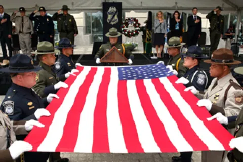CBP officers and agents prepare to fold the U.S. flag during the Valor Memorial Ceremony