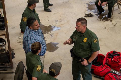 A photo showing Border Patrol agents gathering after exploring. the tunnel