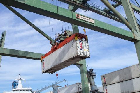A cargo container is removed from a ship and unloading at the Red Hook, N.Y. port of entry.