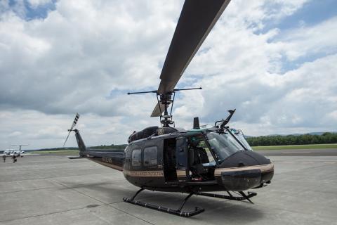 A CBP Bell Huey II readies for take-off.
