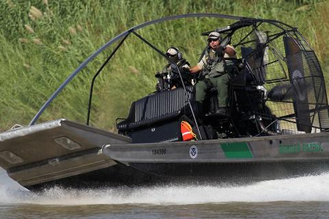 A Border Patrol air boat rides the Rio Grande River near Laredo, Texas.