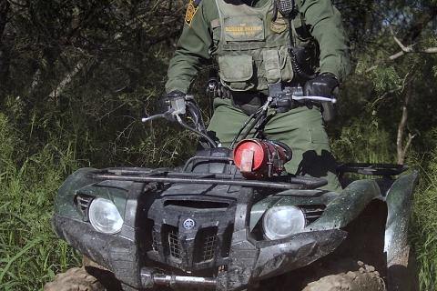 A Border Patrol agent secures the south Texas area on an all-terrain vehicle.