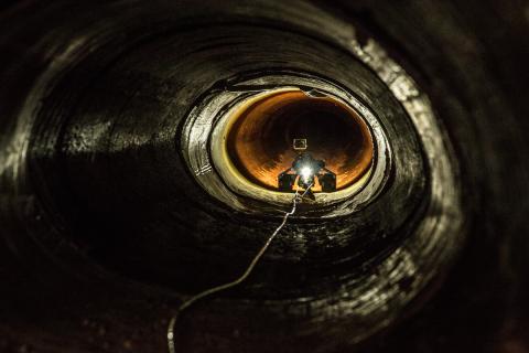 An unmanned robot with camera makes its way through drainage piping near Nogales, Ariz.