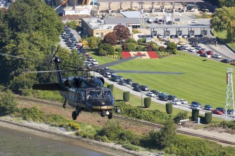 A CBP UH-60 Black Hawk helicopter flies near the U.S.-Canada border in Washington.