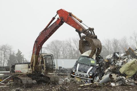 Crane destroying Mini Cooper with importation violations
