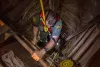 Photo of Border Patrol agent descending into tunnel