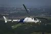 Photo of a CBP helicopter making a steep turn in the skies above Oklahoma City.