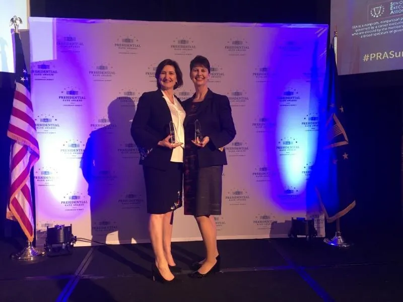 AnnMarie Highsmith, deputy chief counsel, Office of Chief Counsel, left, and Brenda Smith, executive assistant commissioner, Office of Trade, display their Distinguished Executive Presidential Rank Awards.