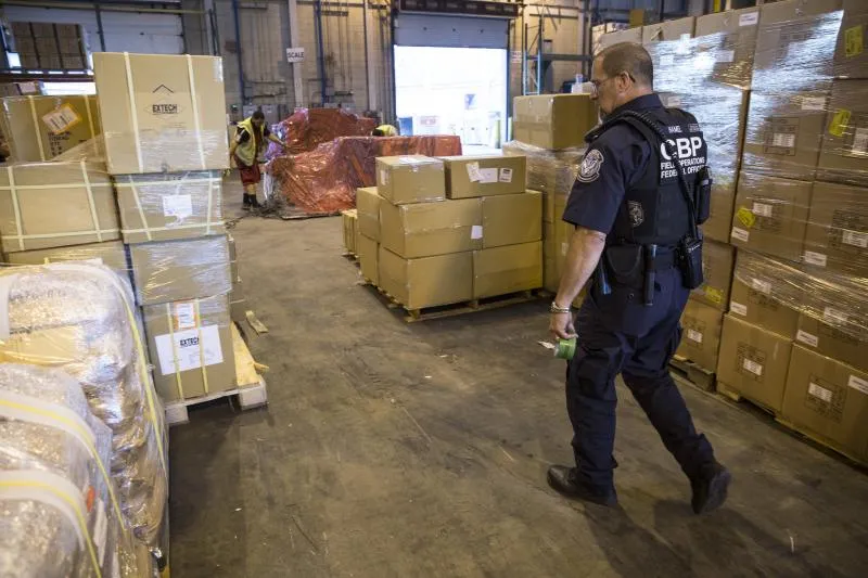 A CBP officer inspects cargo at one of CBP's 328 ports of entry