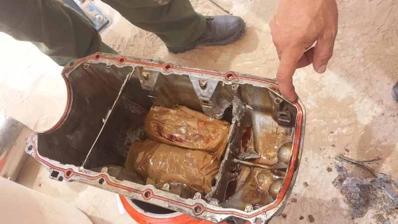 =U.S. Border Patrol agents discovered 30 packages of narcotics in the gas tank of the vehicle, containing methamphetamine combined with a small amount of heroin.