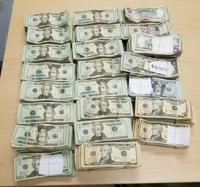 CBP officers discovered eight bundles containing a total of $221,319 in unreported currency hidden within the vehicle.