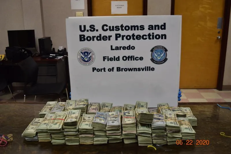 Stacks of bills totaling $306,601 in undeclared currency seized by CBP officers at Brownsville Port of Entry