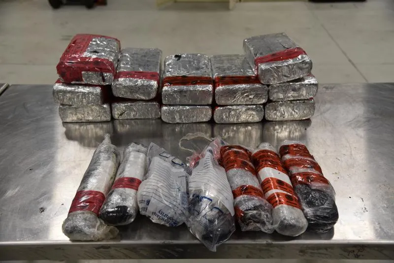 Packages containing 56 pounds of methamphetamine and 16 pounds of heroin seized by CBP officers at Juarez-Lincoln Bridge in Laredo, Texas.