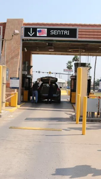 A CBP officer conducts a primary inspection in the SENTRI lane at Hidalgo International Bridge