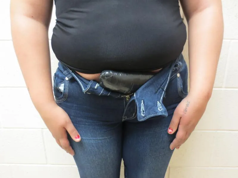 Bundle of methamphetamine concealed in the abdominal area of a female smuggler