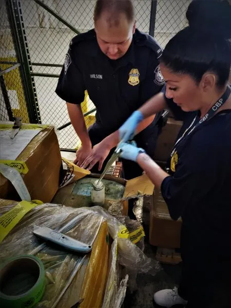 CBP Agriculture and Import speciaists getting sample of seized Kratom