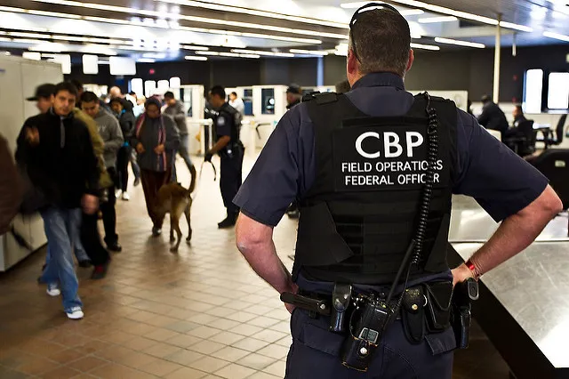 CBP officers enforce applicable law on arriving and departing international travelers.