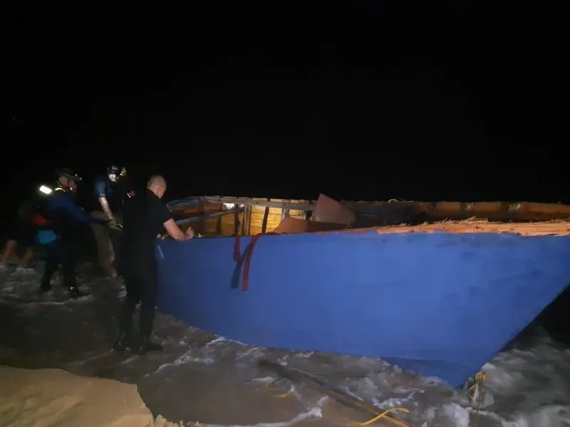 Local partnes revise the yola vessel that capsized near Aguadila, Puerto Rico
