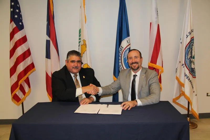 DFO Marcelino Borges (left) and SAC Ricardo Mayoral (right) after the signing of the TECC