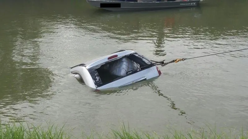 Van loaded with marijuana being removed from the Rio Grande