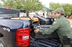 U.S. Border Patrol agents fill gas cans in preparation for hurricane response.