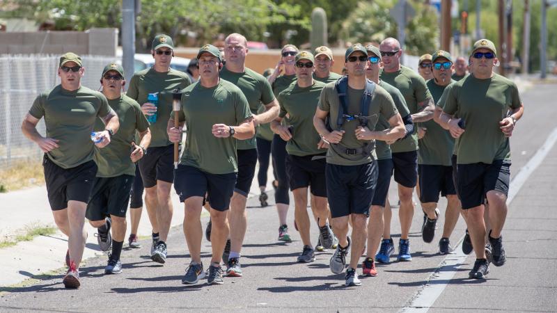 Agents ran a 2-mile leg north from Tucson Sector Headquarters, successfully passing the torch to Tucson Airport Authority officers. 