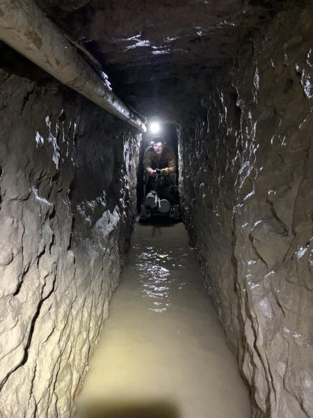 The tunnel is around five and a half feet tall and two feet wide and 4,309 feet long, averaging 70-feet deep and had a ventilation system, electricity and  a rail system designed to move large packs of drugs.  Agents required oxygen canisters while mapping out the tunnel.