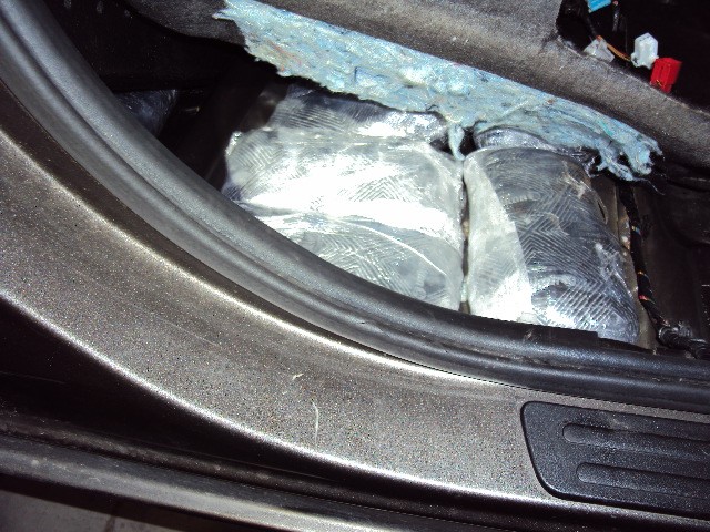 Agents discover 17 packages of meth concealed under the passenger seat.