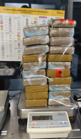 Agents discover 20 packages of cocaine inside car.