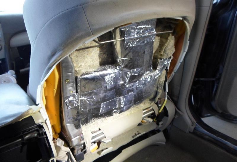 Agents discovered packages of cocaine and fentanyl hidden inside seatback.